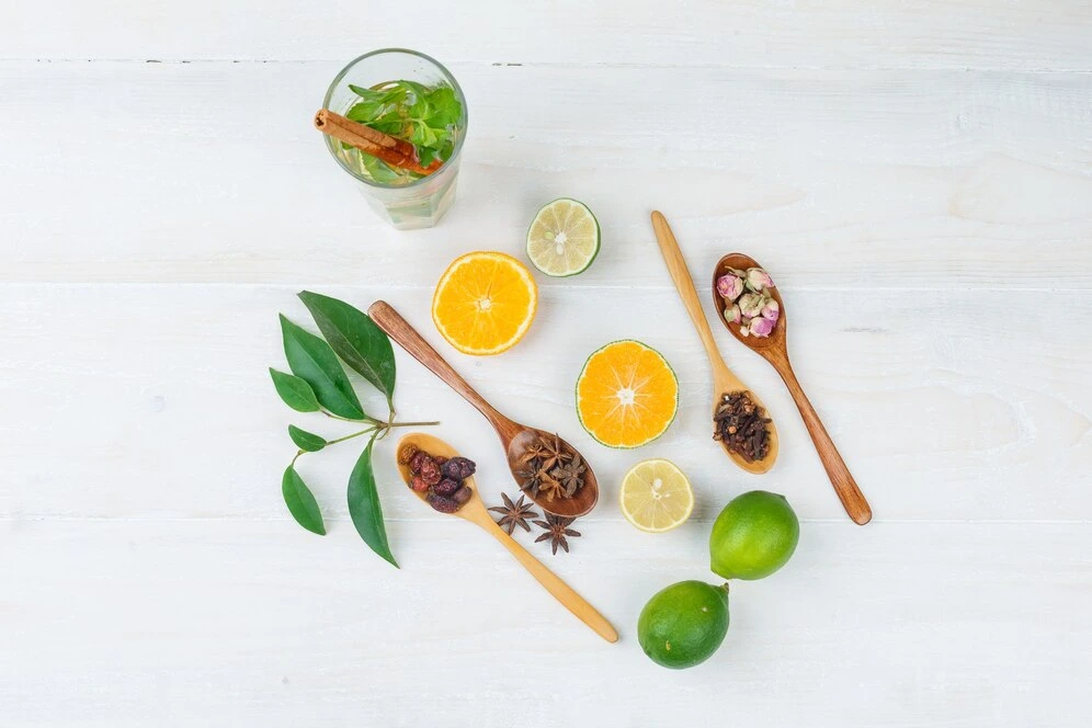 Adrenal cocktail ingredients including orange juice, coconut water, and sea salt on a kitchen counter