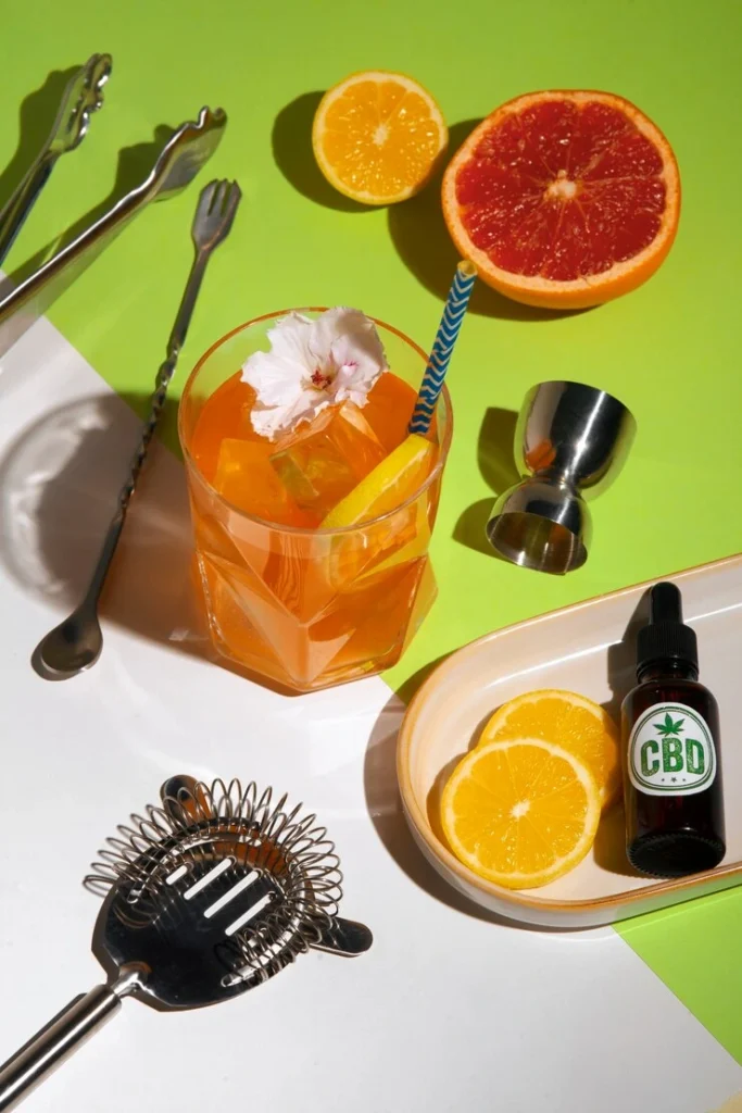 Adrenal cocktail ingredients including orange juice, coconut water, and sea salt on a kitchen counter