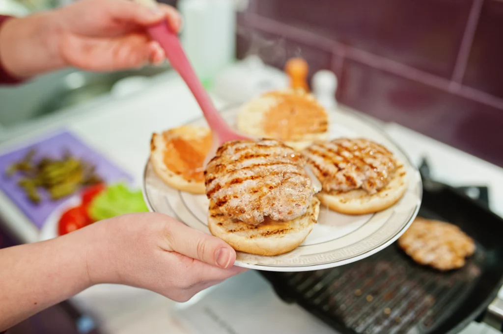 Delicious homemade chicken sliders served with fresh toppings and a side of crispy fries