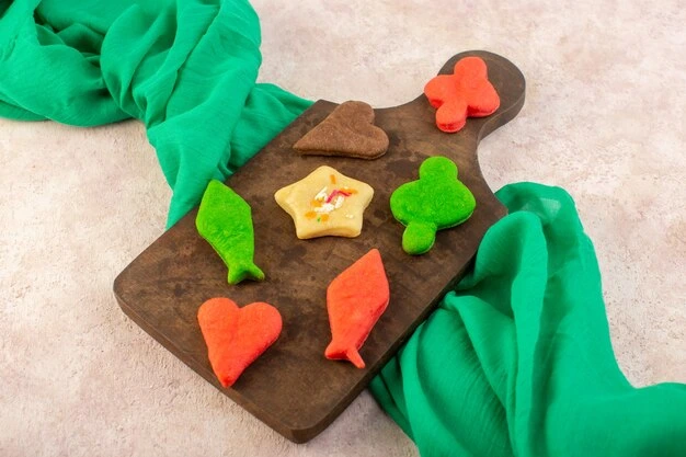 Colorful homemade playdough balls made without cream of tartar, with children's hands playing in the background.