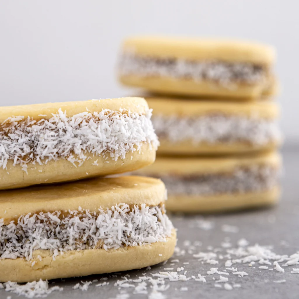 Freshly baked coconut pecan cookies on a plate, showcasing their golden edges and chewy texture.