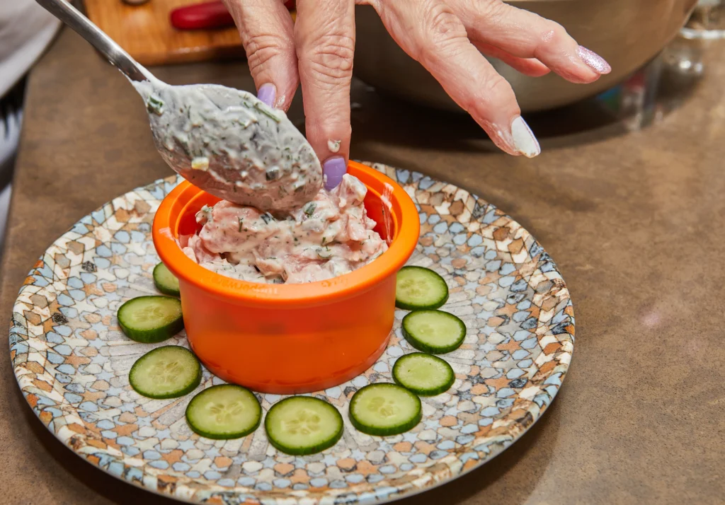 Creamy Boudin Dip served with crispy crackers and garnished with green onions
