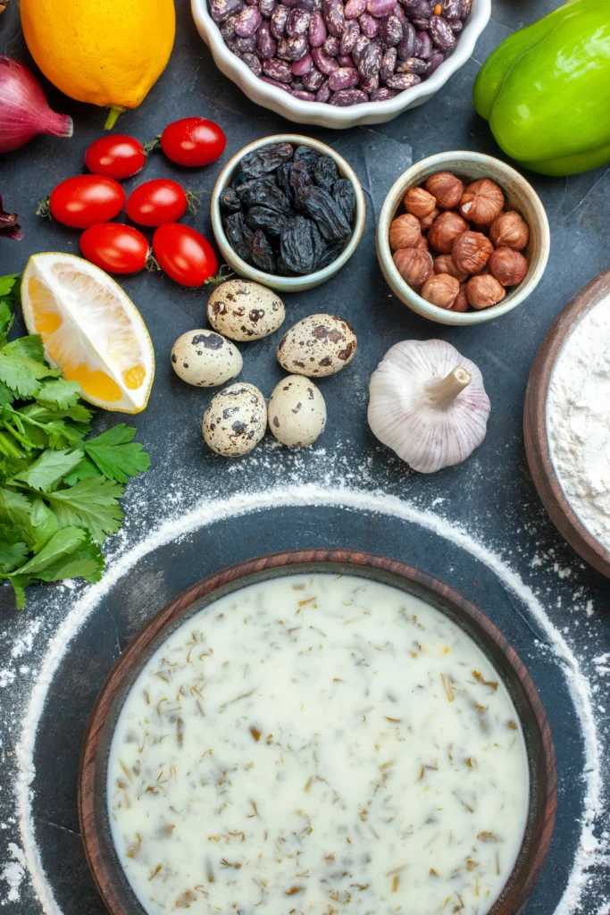 Creamy Boudin Dip served with crispy crackers and garnished with green onions