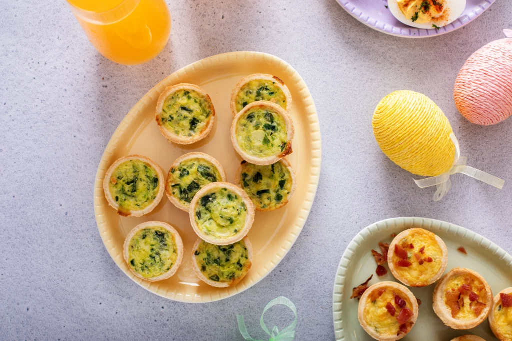 Crispy bacon savoury tart garnished with fresh herbs on a wooden board