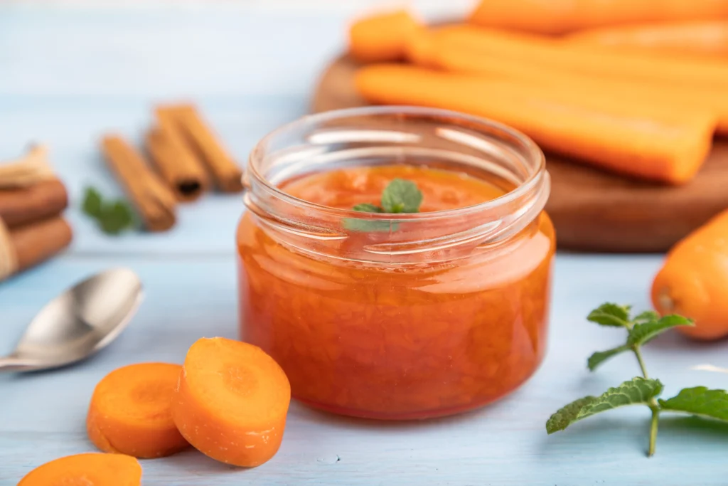 Homemade canned carrots in glass jars, ready for storage