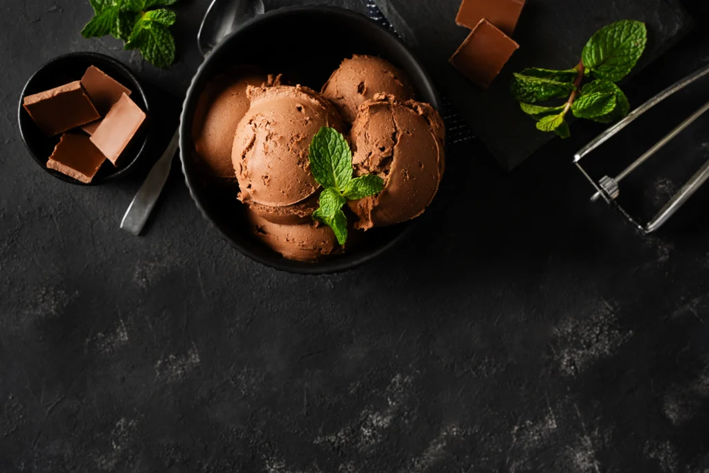 Homemade CHOCLATE ice cream being churned in an electric ice cream maker