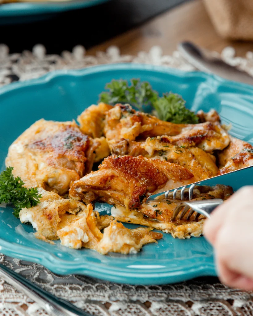 Homemade orange chicken glazed with orange marmalade, served in a bowl with white rice.