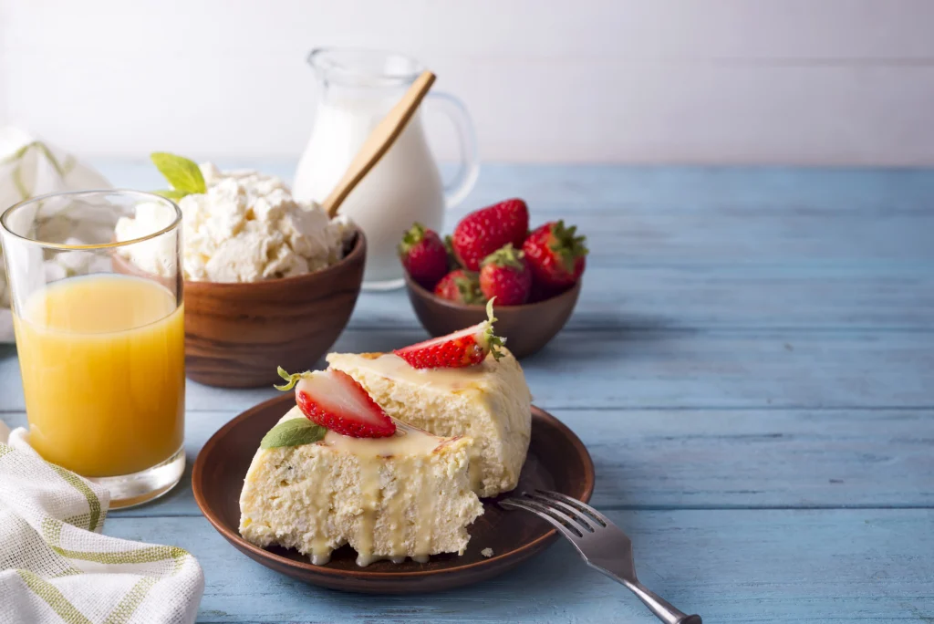 Low-calorie protein cheesecake slice on a plate with a fork