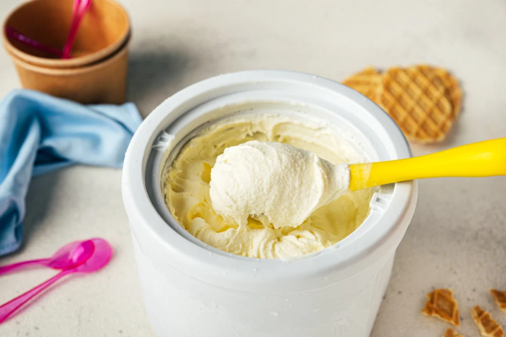 Homemade vanilla ice cream being churned in an electric ice cream maker