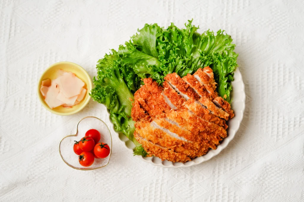 Golden, crispy Ritz cracker chicken baked to perfection and garnished with herbs.