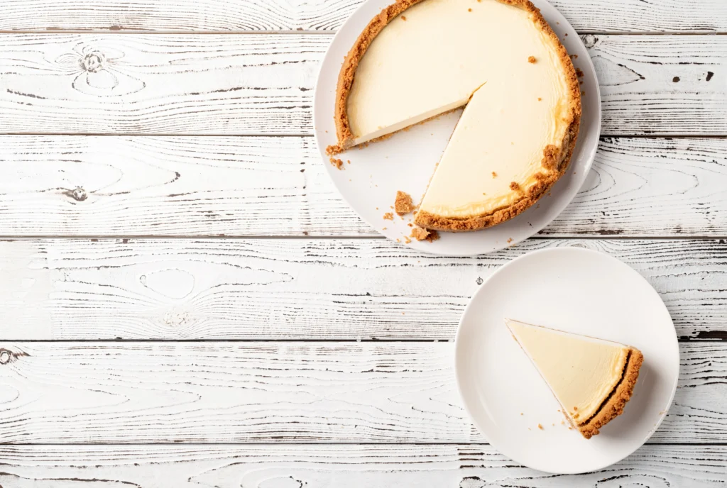 Low-calorie protein cheesecake slice on a plate with a fork