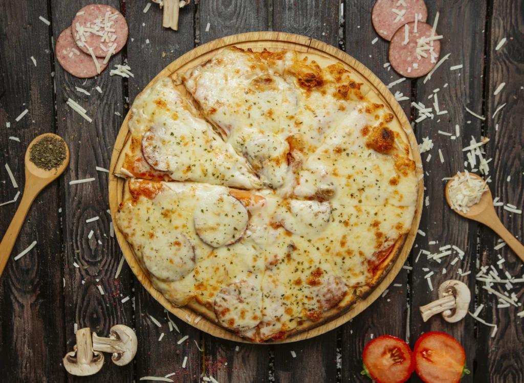 Low-carb chicken pizza crust with toppings of cheese and vegetables