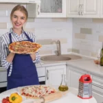 Low-carb chicken pizza crust with toppings of cheese and vegetables