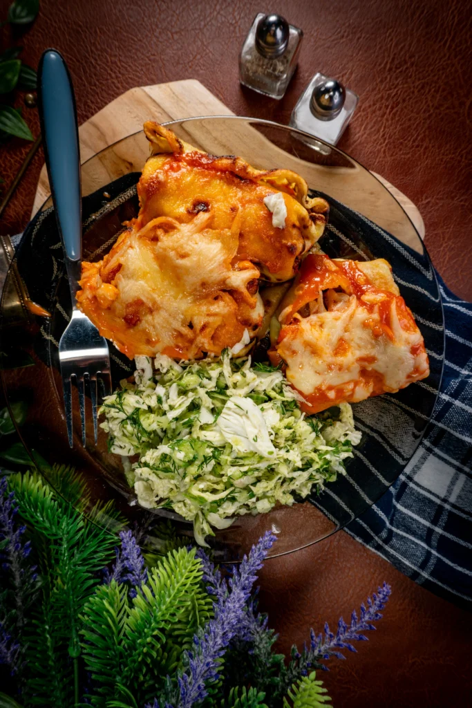 Crispy Air Fryer Chicken Parmesan topped with melted mozzarella and marinara sauce, served with fresh basil garnish