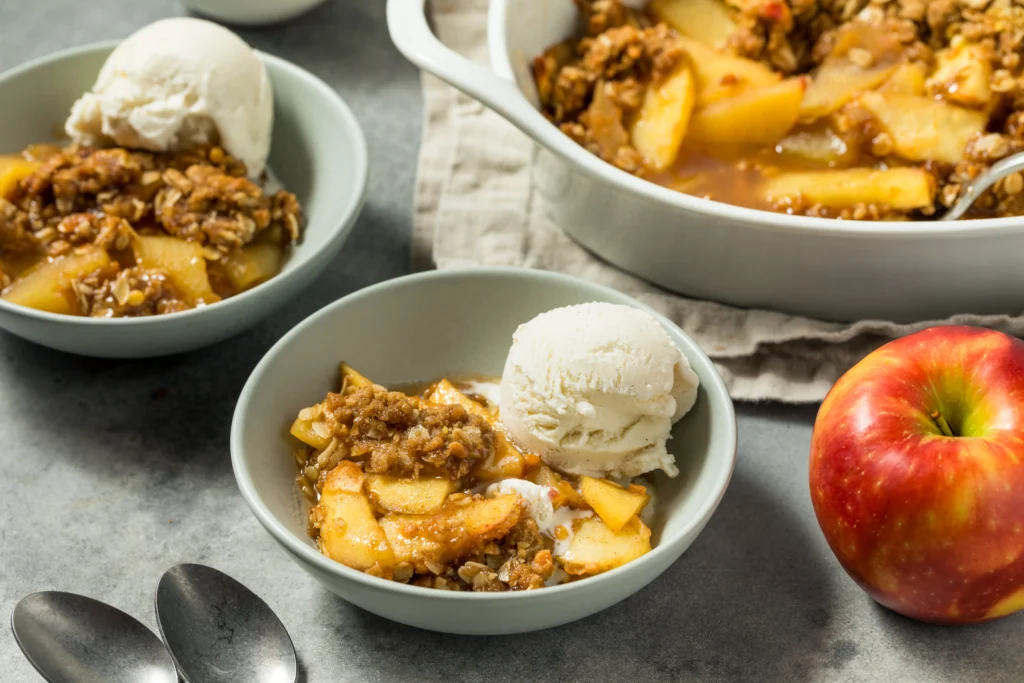 Freshly baked classic peach crisp with a golden, oat topping and juicy peaches.