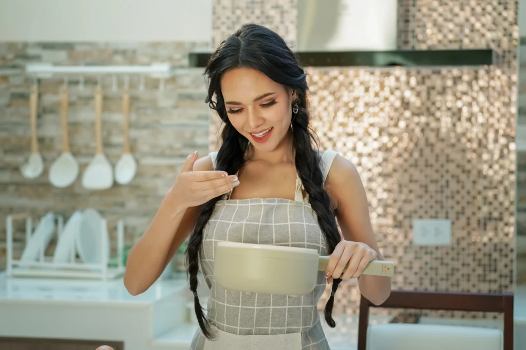 Step-by-step preparation of Blackstone fried rice on a flat top griddle with vegetables, eggs, and rice being stir-fried