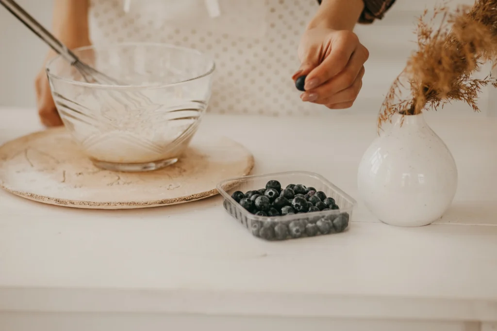Freshly baked homemade blueberry rustic crumble with oats, served warm in a baking dish