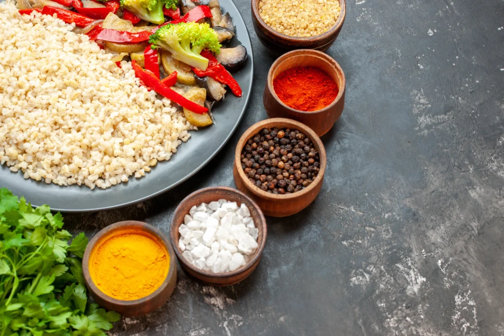 Step-by-step preparation of Blackstone fried rice on a flat top griddle with vegetables, eggs, and rice being stir-fried