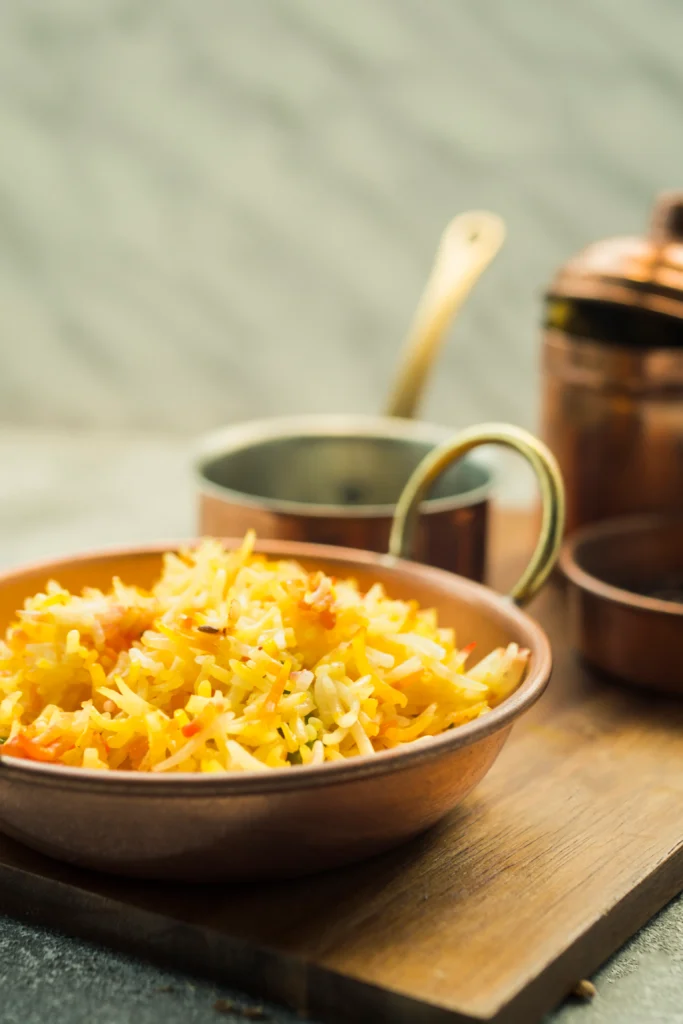 Delicious bowl of comforting cheesy rice topped with fresh parsley