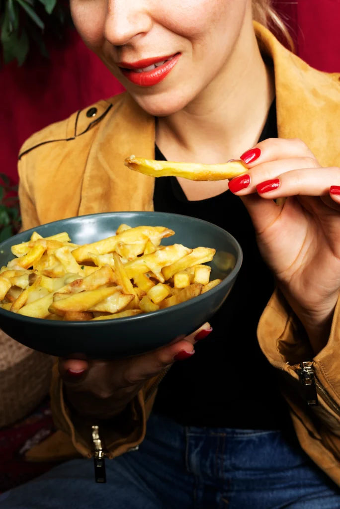 Creamy holiday party potatoes casserole topped with golden crunchy cornflakes served in a festive baking dish