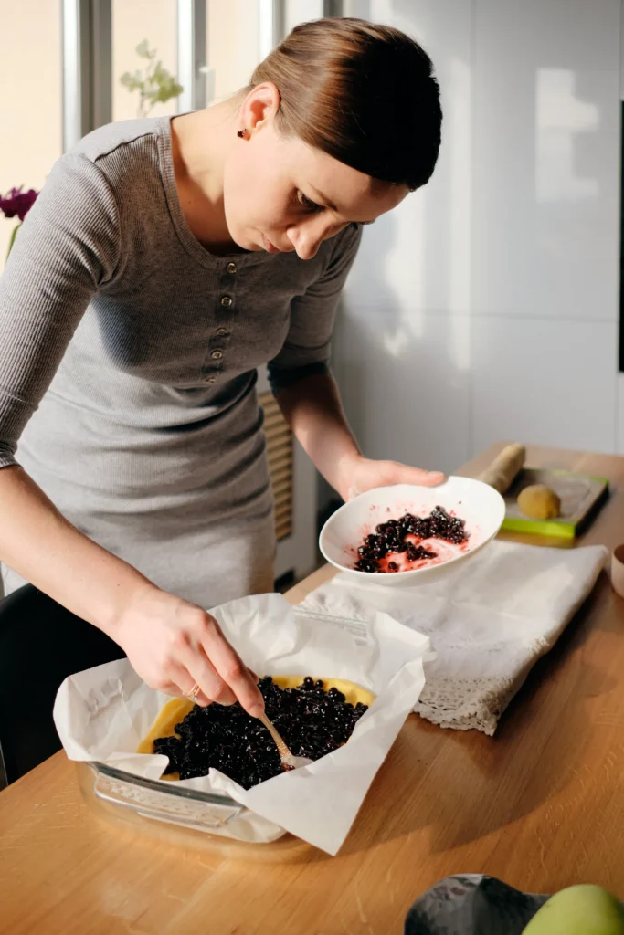 Freshly baked homemade blueberry rustic crumble with oats, served warm in a baking dish
