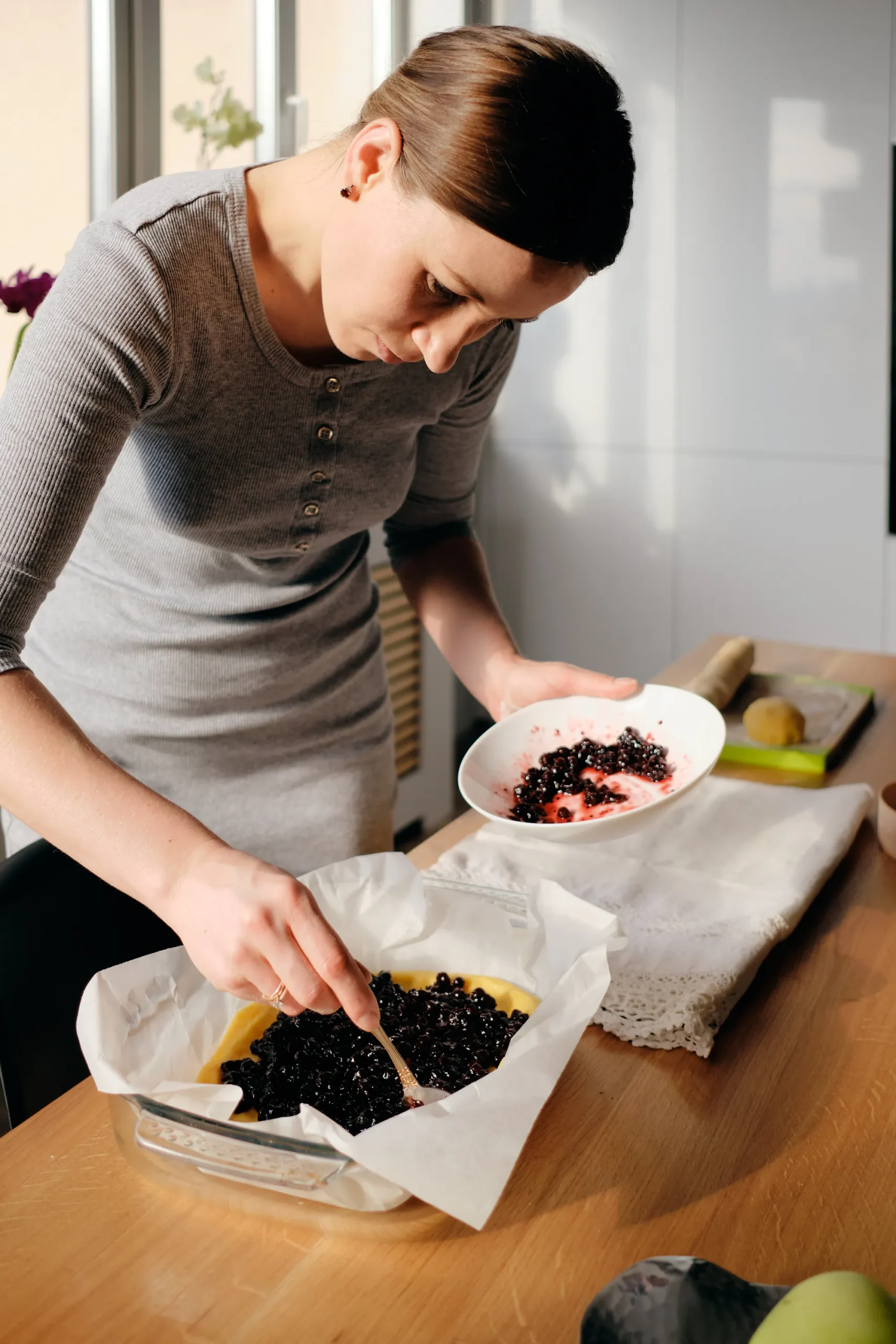 Freshly baked homemade blueberry rustic crumble with oats, served warm in a baking dish
