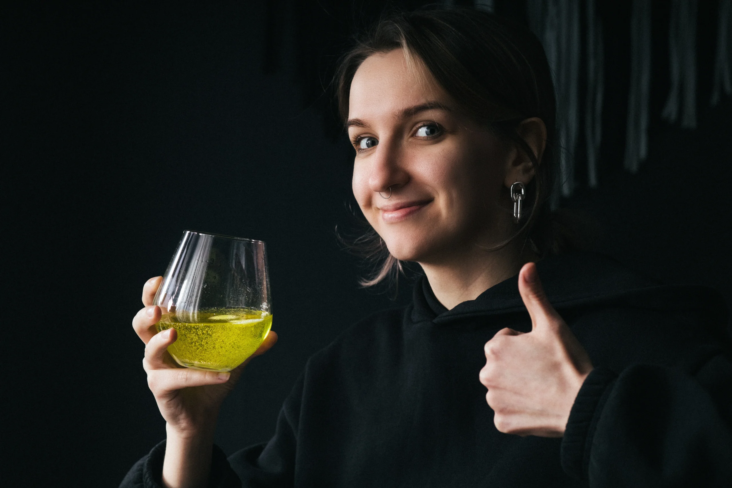 Refreshing homemade limoncello in a glass bottle with fresh lemons