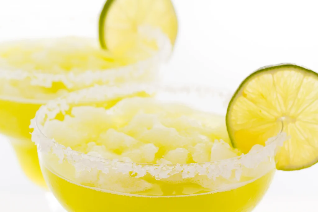 Skinny Margarita cocktail with lime and salt rim on a glass