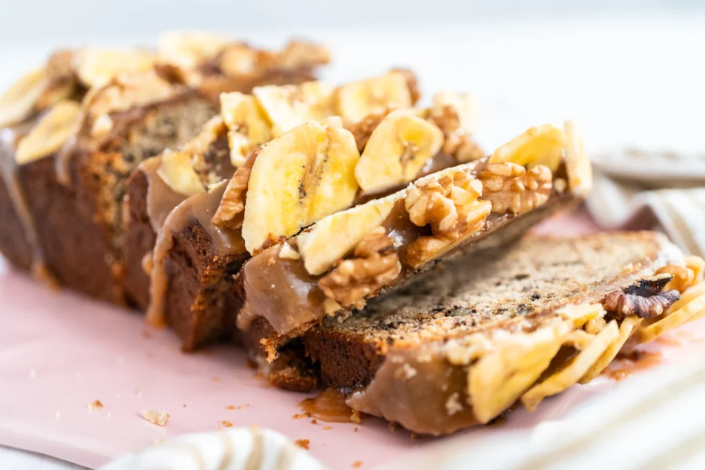 Chocolate Chip Banana Bread Recipe
Freshly baked chocolate chip banana bread topped with toasted walnut crunch on a wooden cutting board
