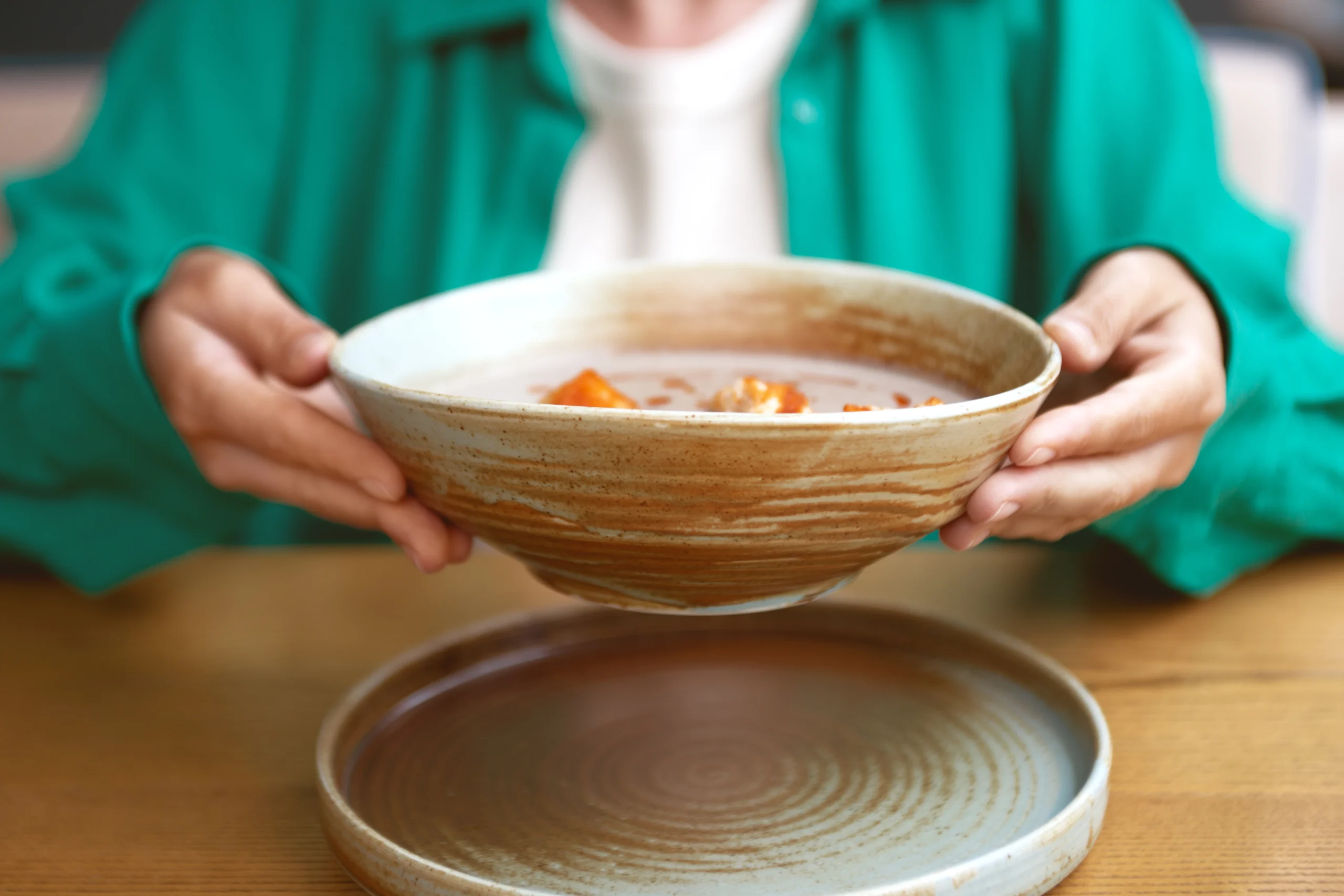 Homemade Ham and Bean Soup with Great Northern Beans in a bowl, garnished with fresh herbs and served with crusty bread