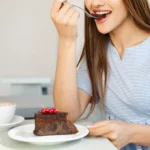 Homemade Texas sheet cake topped with rich chocolate frosting and chopped pecans
