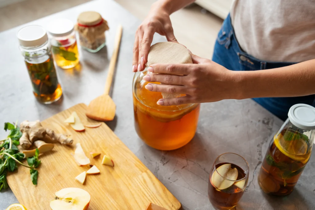 Authentic Kombucha Recipe
Authentic kombucha brewing at home using four simple ingredients with SCOBY, tea, sugar, and water in a glass jar