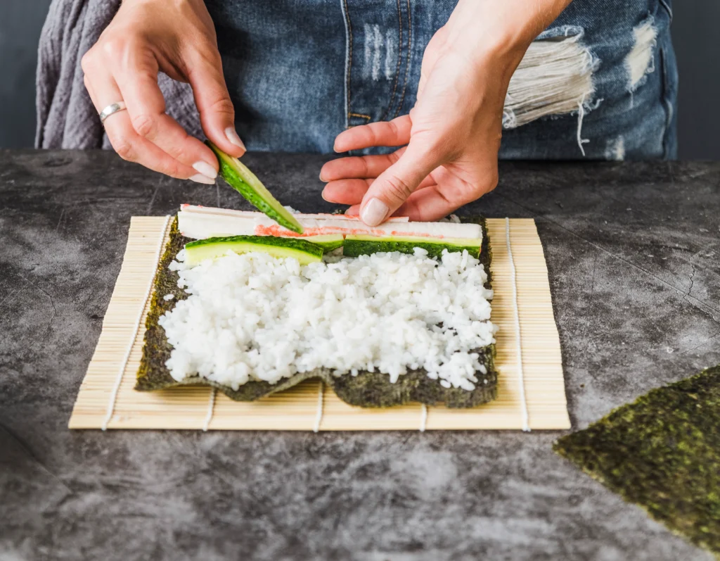 Traditional Japanese onigiri rice balls wrapped in seaweed, ready to eat.