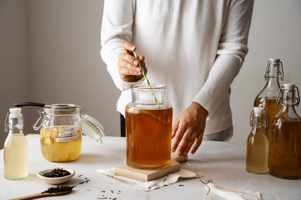 Authentic Kombucha Recipe

uthentic kombucha brewing at home using four simple ingredients with SCOBY, tea, sugar, and water in a glass jar