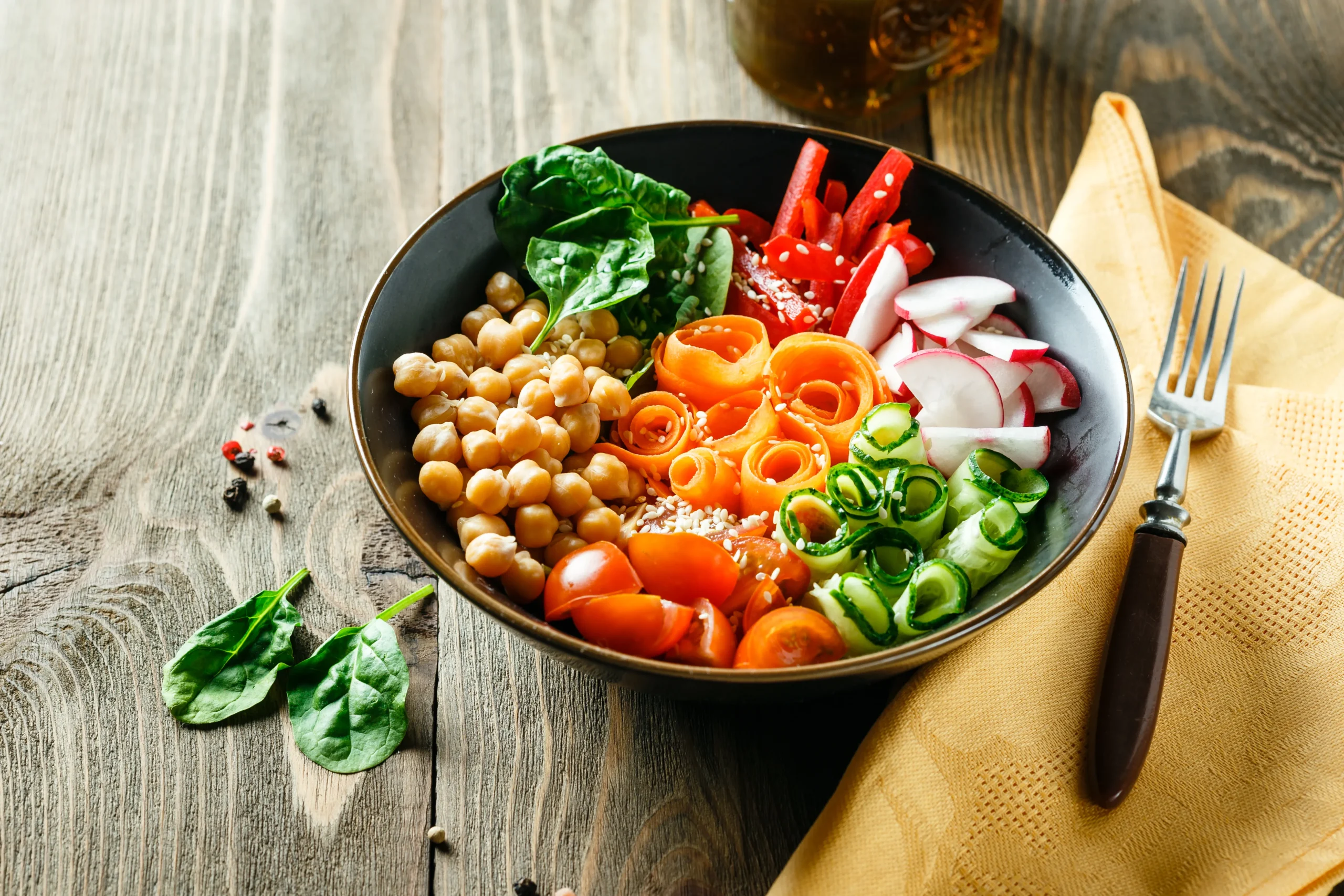 Delicious crispy chickpea and veggie bowl with quinoa, roasted vegetables, and tahini dressing