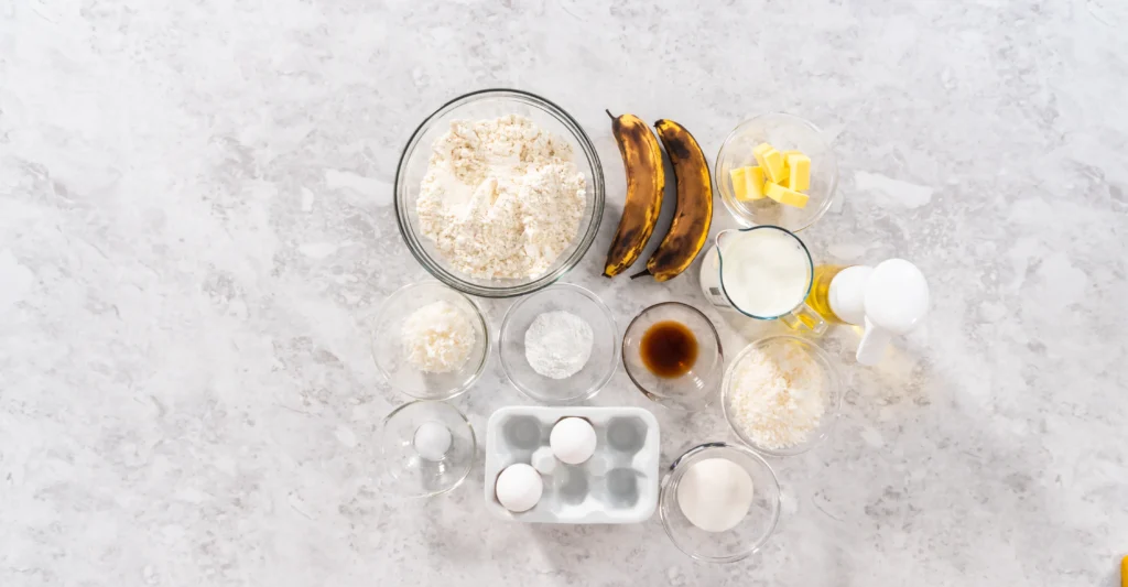 Slice of banana almond butter toast with banana slices, almond butter spread, and whole grain bread
