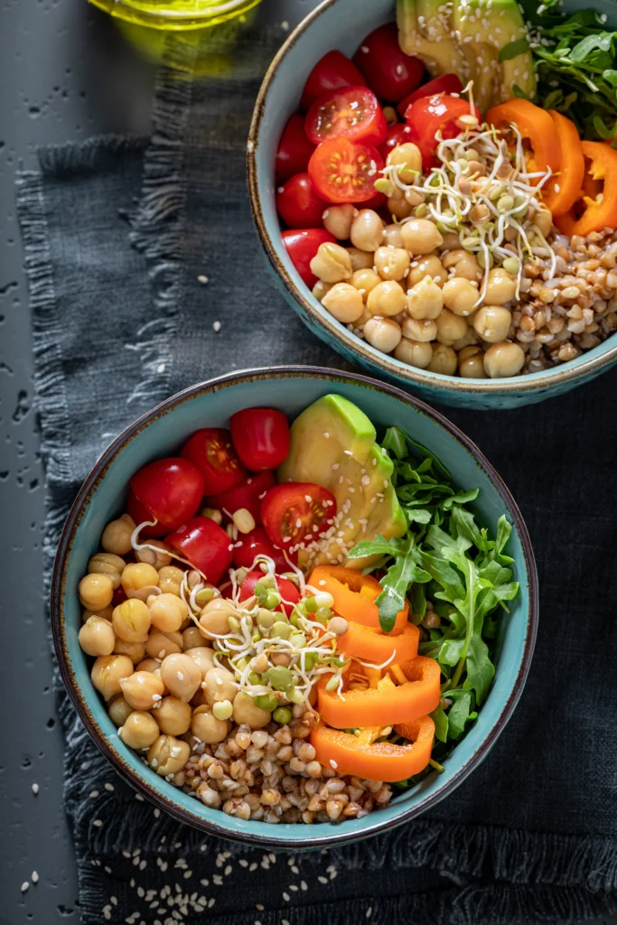 Delicious crispy chickpea and veggie bowl with quinoa, roasted vegetables, and tahini dressing