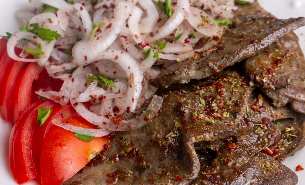 Gyro Meat Recipe
Close-up of homemade gyros with tender sliced gyro meat, fresh vegetables, and tzatziki sauce wrapped in warm pita bread