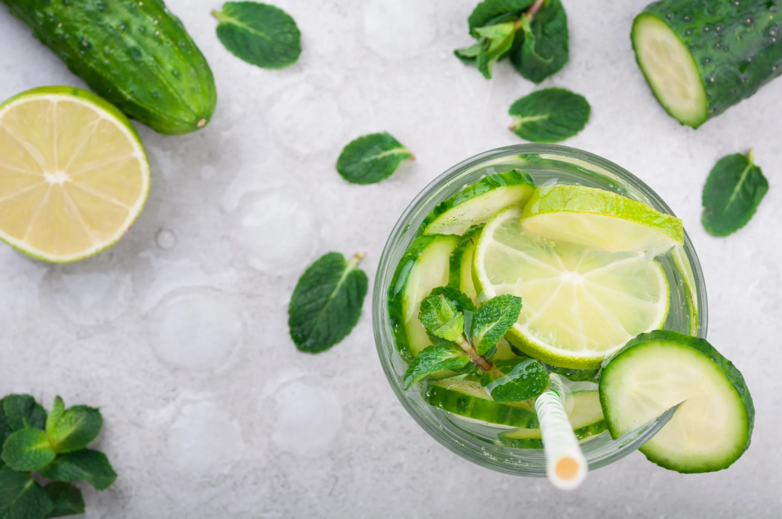 Cucumber and Mint Detox Water in a glass with fresh ingredients