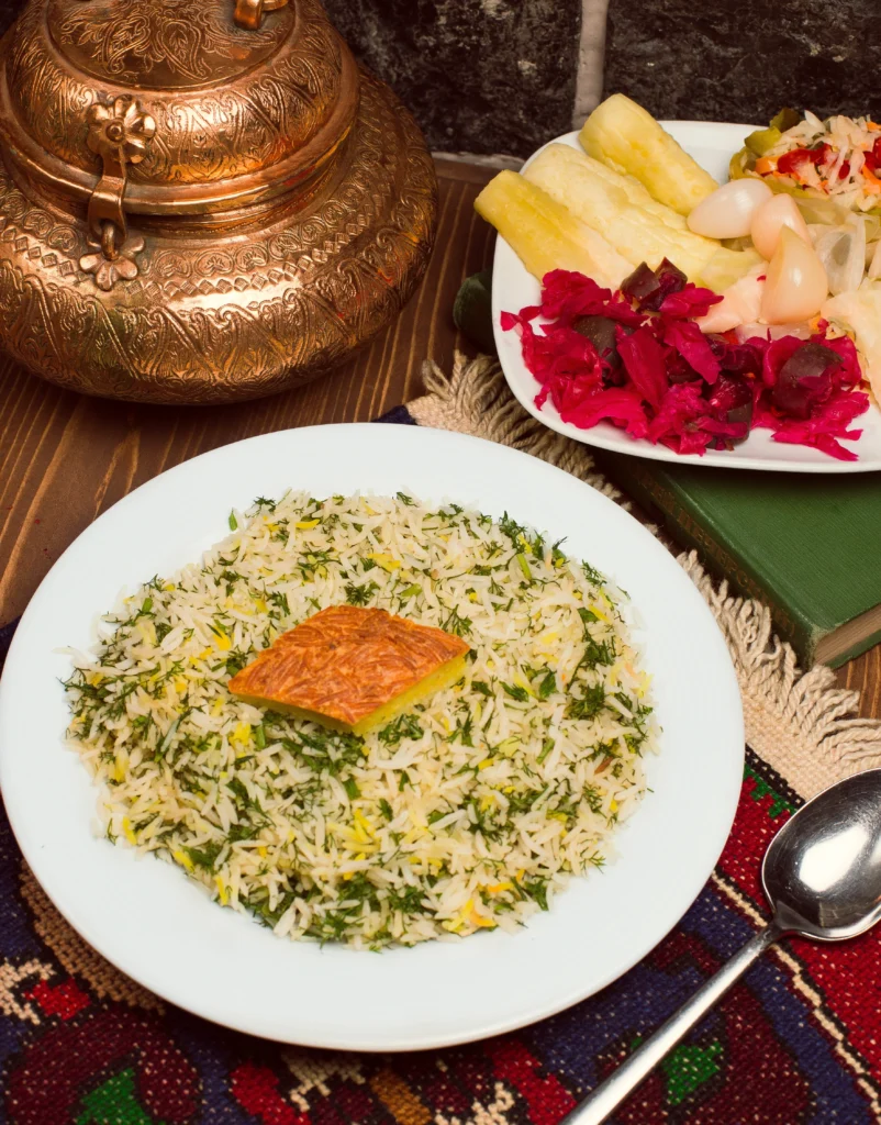 Persian Herb & Yogurt Rice (Sabzi Polo) served on a plate with fresh herbs and fluffy basmati rice