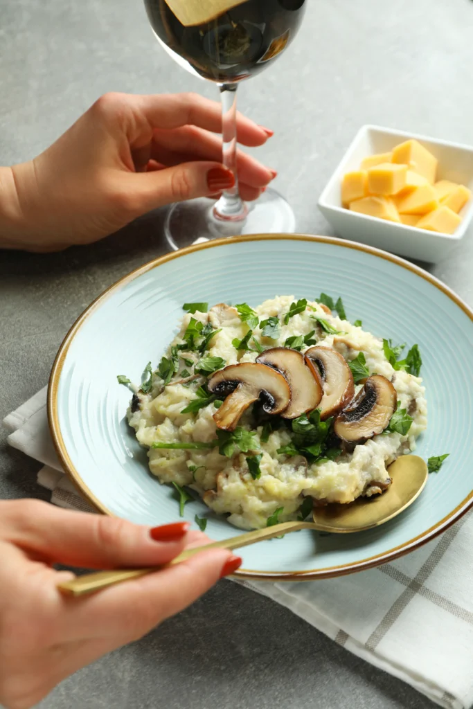 Creamy truffle mushroom risotto served in a white bowl, garnished with parmesan and fresh thyme for a romantic Valentine’s Day dinner at home.