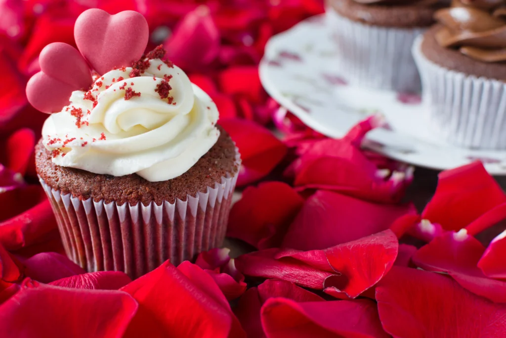 Delicious red velvet cupcakes topped with creamy cream cheese frosting, perfect for Valentine’s Day
