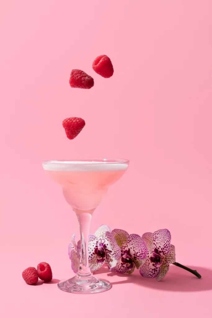 Berry Love Mocktail
A romantic Valentine’s Day berry mocktail in a heart-shaped glass, garnished with fresh strawberries, raspberries, and mint leaves on a festive pink table setting.