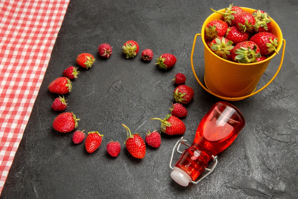 Berry Love Mocktail
A romantic Valentine’s Day berry mocktail in a heart-shaped glass, garnished with fresh strawberries, raspberries, and mint leaves on a festive pink table setting.