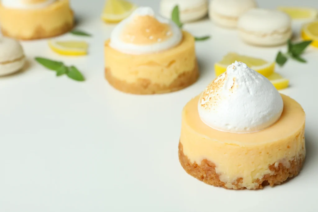 Mini Lemon Chia Cheesecakes topped with fresh lemon zest and berries, low-sugar and gluten-free healthy dessert.