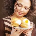 Mini Lemon Chia Cheesecakes topped with fresh lemon zest and berries, low-sugar and gluten-free healthy dessert.