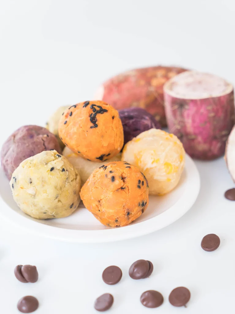 Healthy Japanese Sweet Potato Mochi Bites served on a wooden plate, showcasing their chewy texture and natural ingredients.