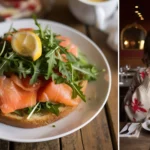 Smoked salmon crostini topped with fresh dill and capers on a bed of herb-infused cream cheese and toasted baguette slices.