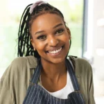 Easy homemade Cracker Barrel-style meatloaf on a plate with mashed potatoes and gravy