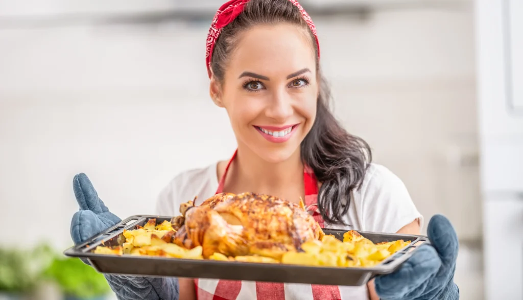 Traditional Peking Duck served with hoisin sauce, thin pancakes, and fresh scallions on a wooden platter